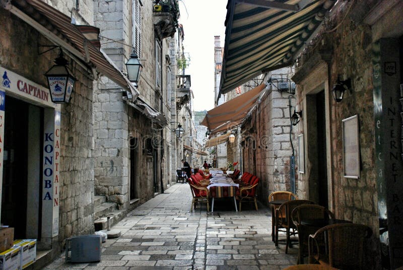 Restaurant terrace in the old town of Dubrovnik, in the narrow streets, are ready for tourists from all over the world. Restaurant terrace in the old town of Dubrovnik, in the narrow streets, are ready for tourists from all over the world