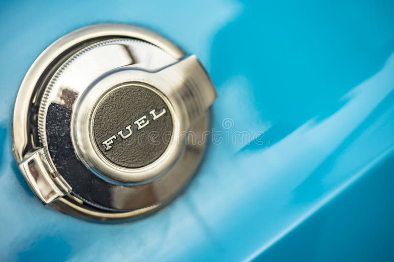 Vicenza, Italy 19 March 2024: Close-up of a shiny chromed fuel cap on a Dodge Challenger, adding flair to vintage car detail. Vicenza, Italy 19 March 2024: Close-up of a shiny chromed fuel cap on a Dodge Challenger, adding flair to vintage car detail