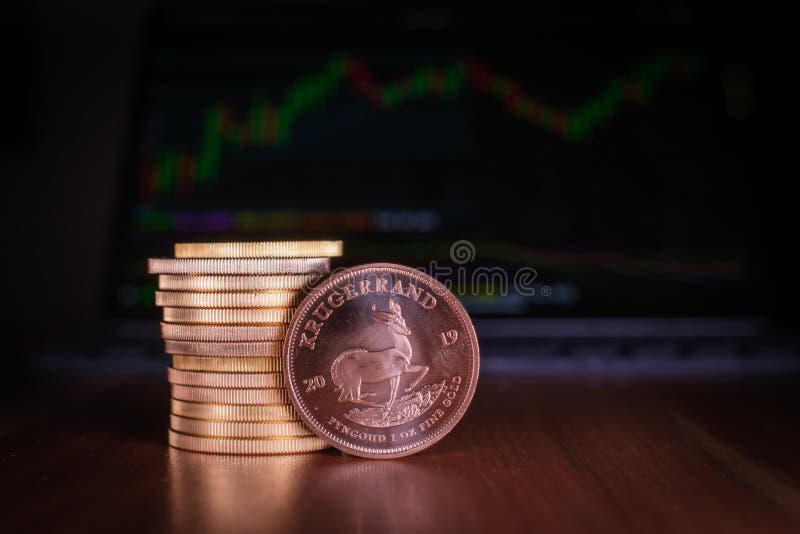 Krugerrand Gold Coin Stands on a Pile of Gold Coins on Spread Out Euro
