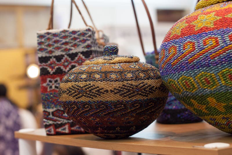 Jug storage and basket made of clay decorated with colorful string hand crafted from traditional Indonesia culture Asia. Jug storage and basket made of clay decorated with colorful string hand crafted from traditional Indonesia culture Asia