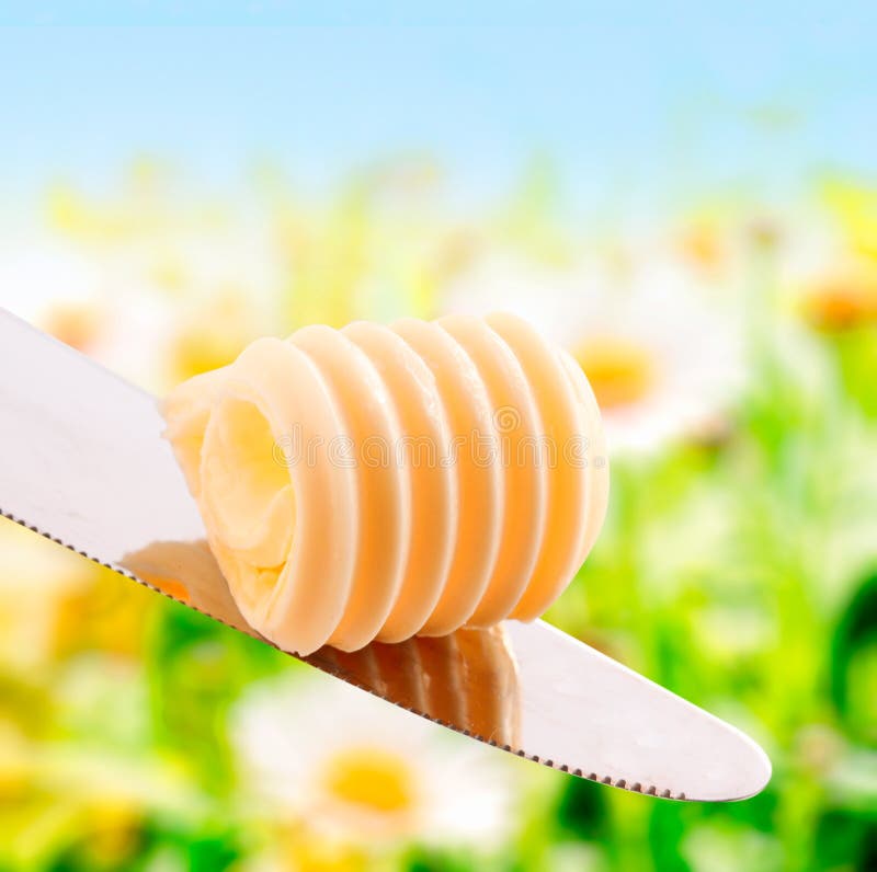 Virvel av färskt sommar smör royaltyfri bild