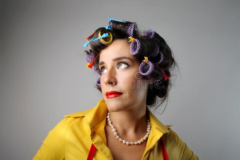 Portrait of housewife with curlers. Portrait of housewife with curlers