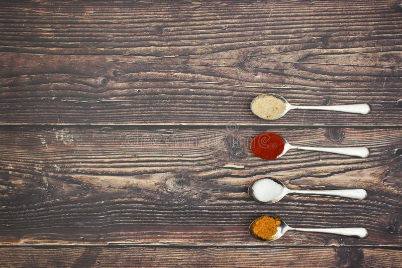 Spices in 4 spoons on the table. Spices in 4 spoons on the table.