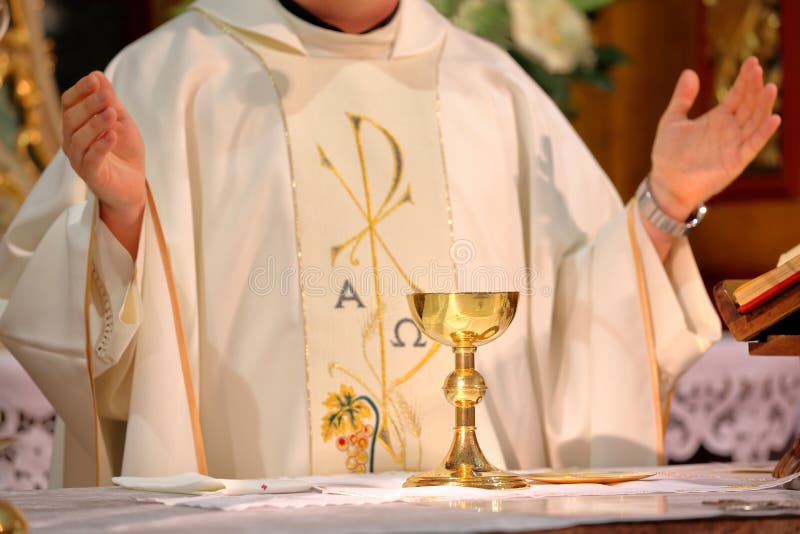 Priest celebrate mass at the church and empty place for text. Priest celebrate mass at the church and empty place for text