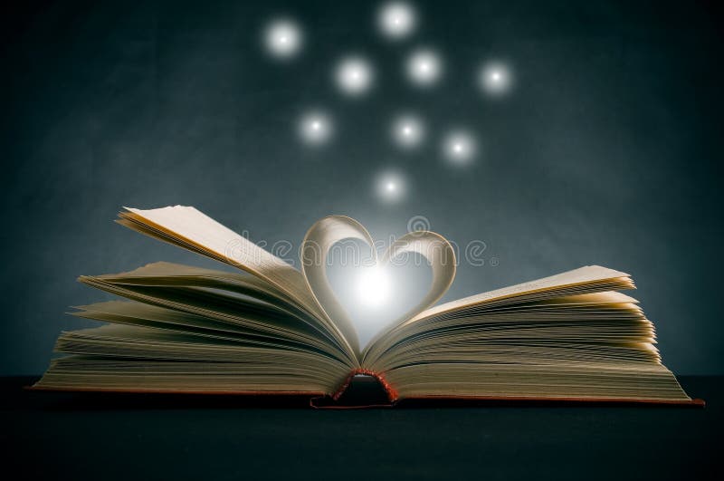 Pages of a book curved into a heart shape. Pages of a book curved into a heart shape