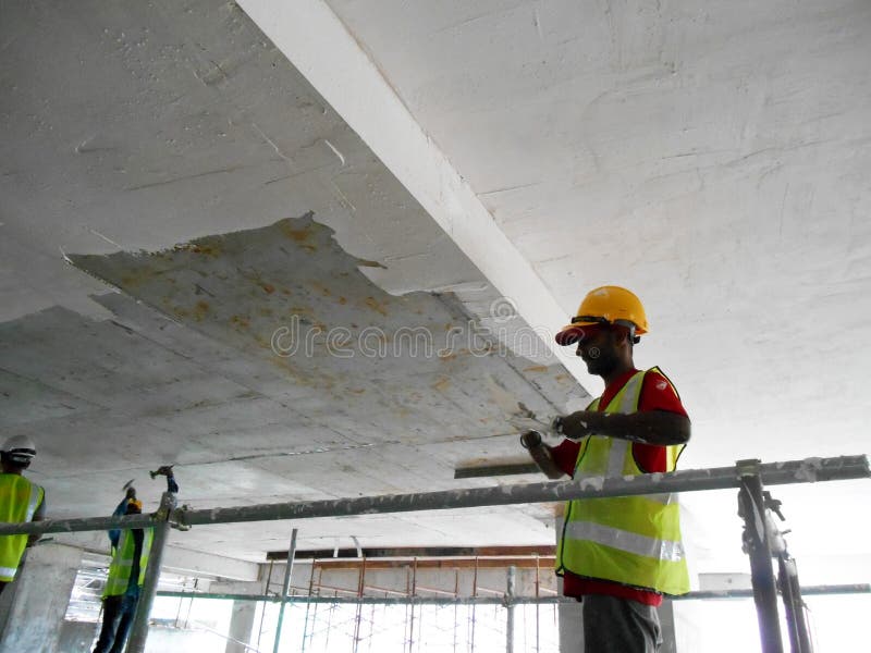 Construction Site Workers are Doing Ceiling Soffit Skim Coat Work at