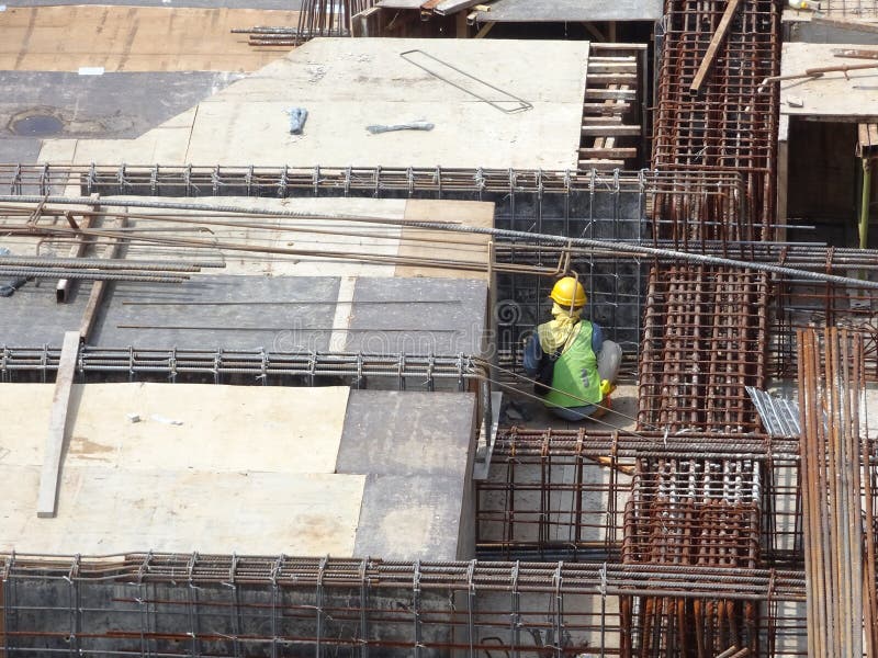 Construction Workers Install Reinforcement Bars at the Construction Site. Editorial Photo