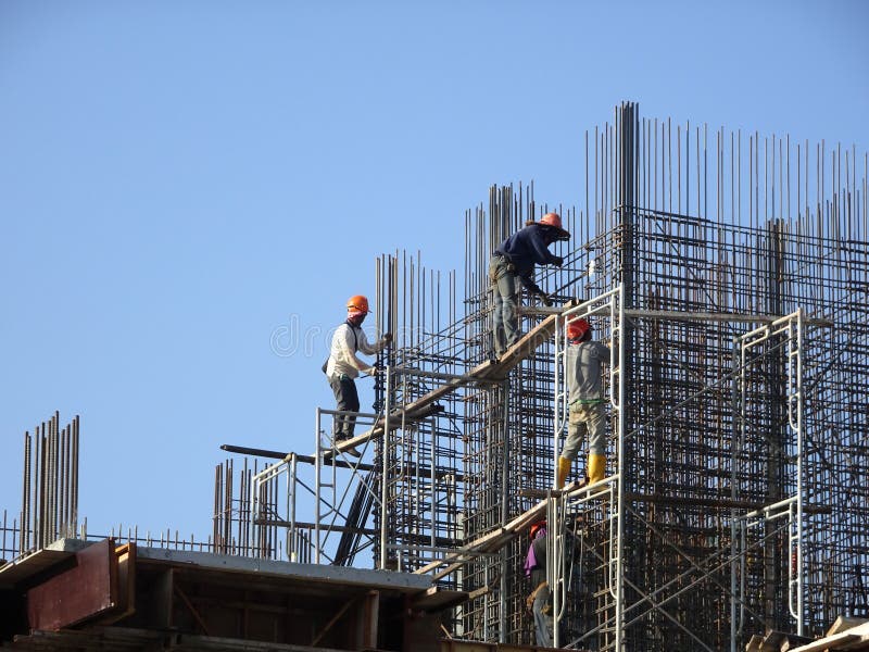 Construction Workers Install Reinforcement Bars at the Construction Site. Editorial Image