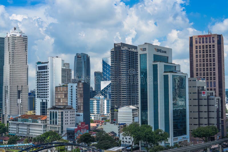 Kuala Lumpur, Malaysia - 26 August 2023: Malaysian buildings and big scyscrappers against blue sky