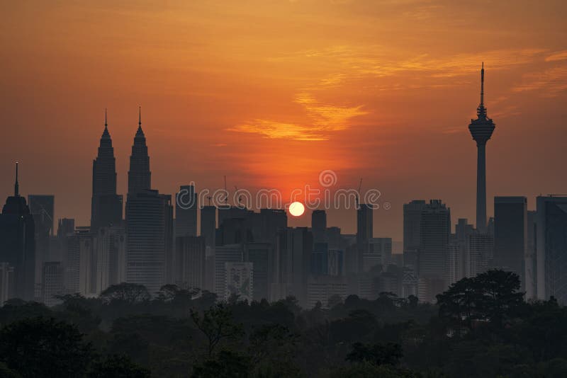 Kuala Lumpur, MALAYSIA - circa February, 2018: Kuala Lumpur city skyline during hazy sunrise. royalty free stock image Kuala Lumpur, MALAYSIA - circa February, 2018: Kuala Lumpur city skyline during hazy sunrise. royalty free stock image