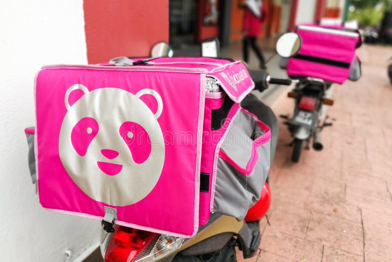 KUALA LUMPUR, MALAYSIA, September 17, 2019: Foodpanda riders waiting outside restaurants for food delivery services assignment.    Foodpanda is a up and coming food delivery service provider in Malaysia, app, application, asia, cashless, collaboration, convenience, digital, dinner, editorial, employment, job, lunch, motorbike, motorcycle, online, order, people, phone, retail, technology, thermal, bag, transport, transportation