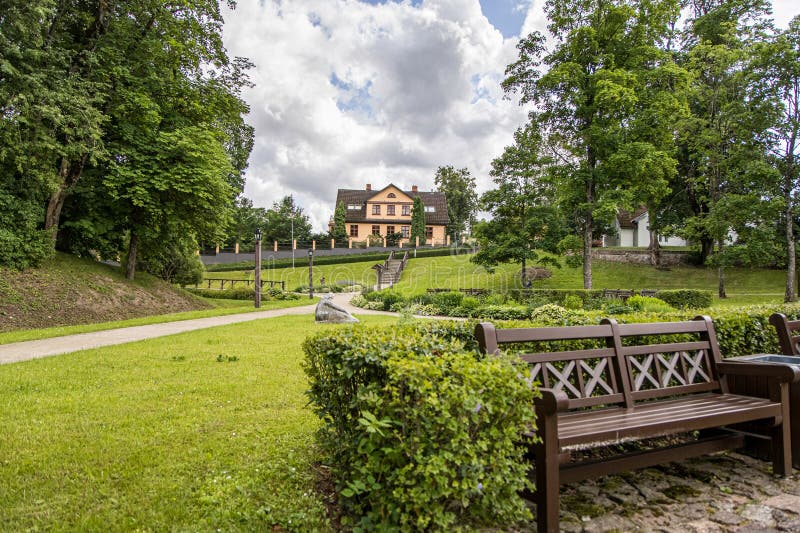 Kuldiga, Latvia - July 3, 2023: Kuldiga city Pils Castle garden park with pond, fountains stock photo
