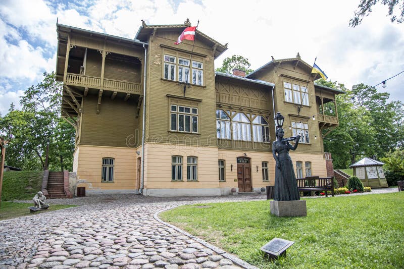 Kuldiga, Latvia - July 3, 2023: Kuldiga district museum historic green wooden building in Latvia. royalty free stock photo