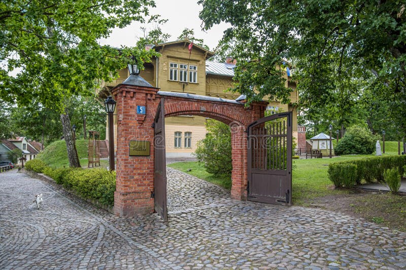 Kuldiga, Latvia - July 3, 2023: Kuldiga district museum and open gates in winter day, Latvia royalty free stock image