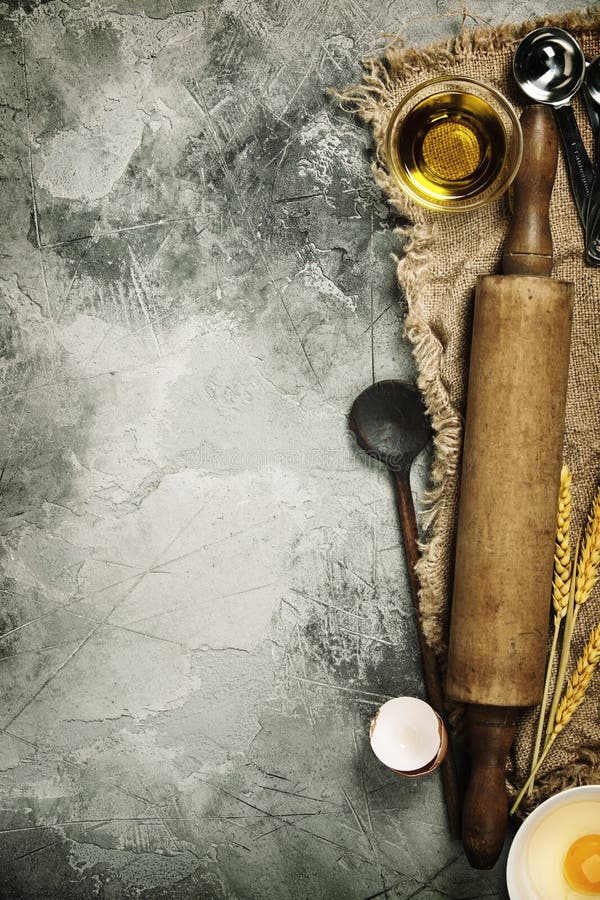 Top view on Old Kitchen cooking utensils on grey stone table - cooking concept. Top view on Old Kitchen cooking utensils on grey stone table - cooking concept