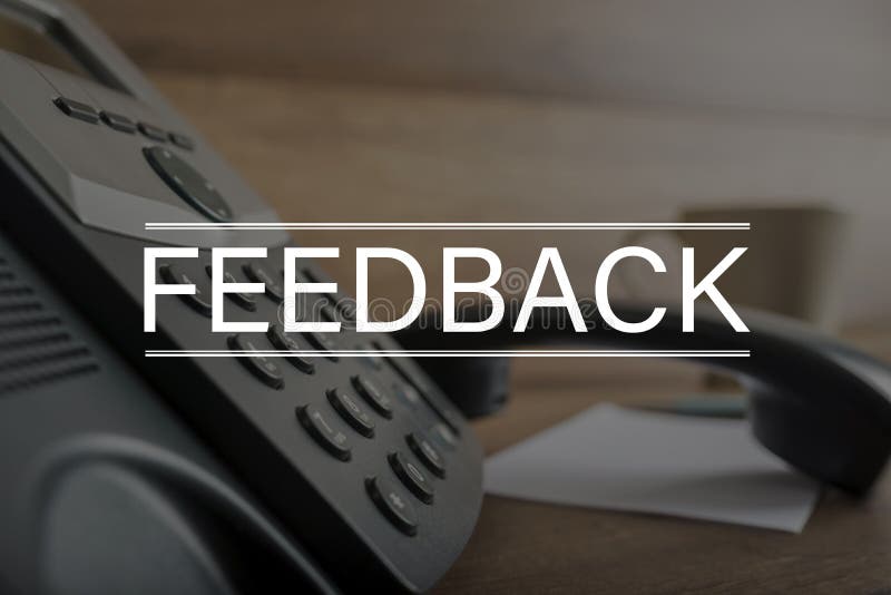 Word Feedback in front of a telephone with a number pad and the handset or receiver off the hook in customer service and relations concept. Word Feedback in front of a telephone with a number pad and the handset or receiver off the hook in customer service and relations concept