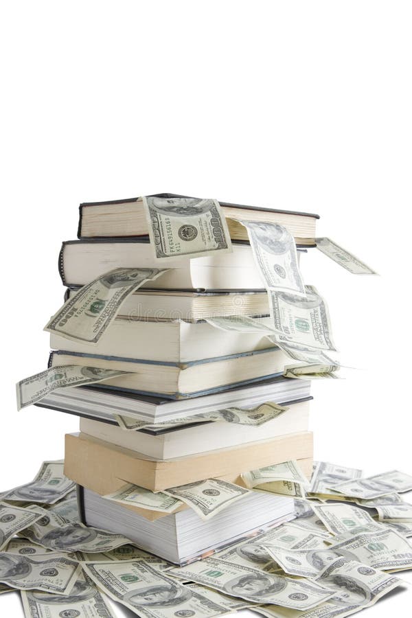 Books stacked on top of one hundred dollar bills. Books stacked on top of one hundred dollar bills