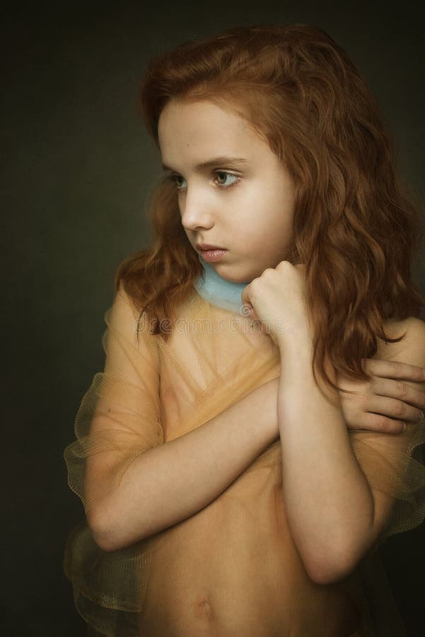 Portrait of a girl on the background of a canvas dressed in a tulle. Portrait of a girl on the background of a canvas dressed in a tulle