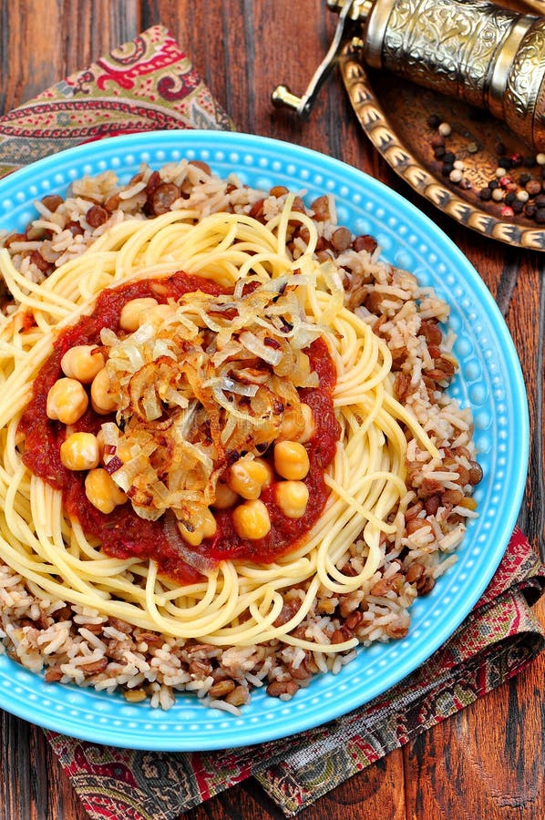 Kushari - Egyptian Dish of Lentils, Rice, Pasta, Chickpeas with Tomato ...