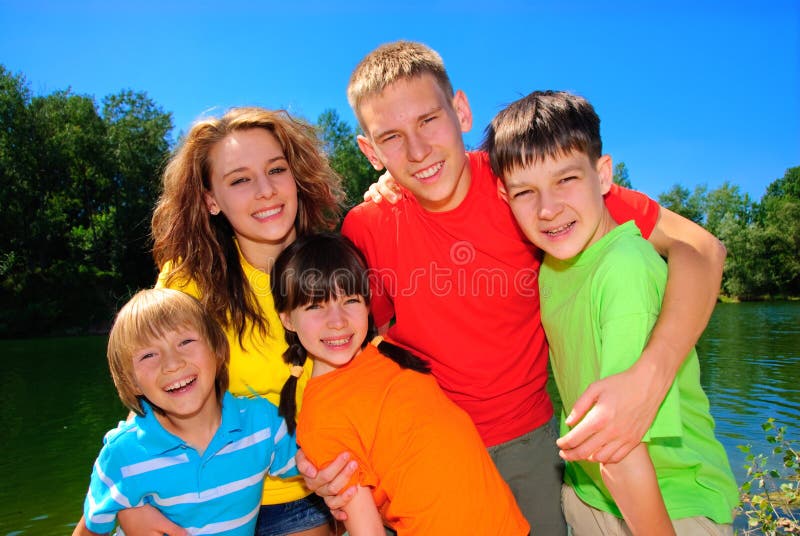 Cousins together outside on summer day. Cousins together outside on summer day