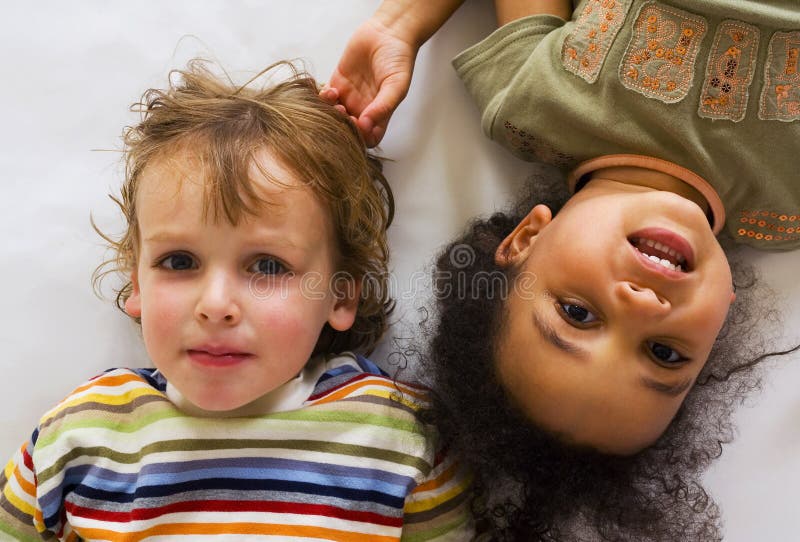 A beautiful mixed race girl and her blond cousin having fun. A beautiful mixed race girl and her blond cousin having fun