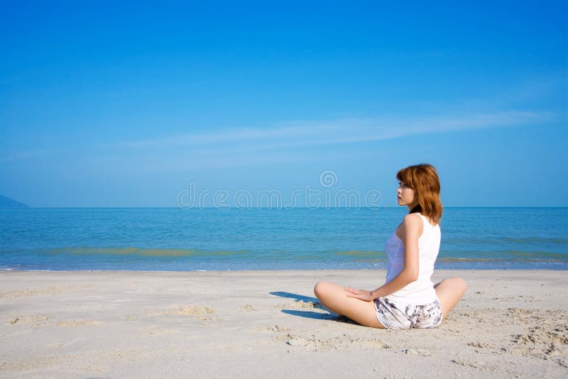 Woman relaxing look side way by the beach. Woman relaxing look side way by the beach