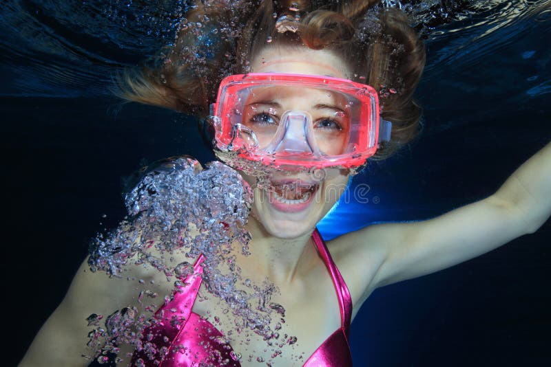 Female diver screaming underwater with bubbles. Female diver screaming underwater with bubbles