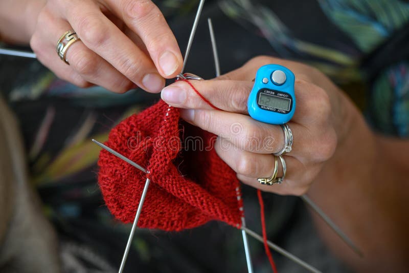 Woman knitting socks with knitting needles, close-up view of knitting needles and yarn, home hobby, Handmade 9. Woman knitting socks with knitting needles, close-up view of knitting needles and yarn, home hobby, Handmade 9