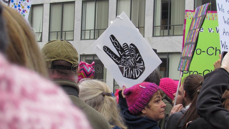 Washington, DC / USA - 01/21/2017: Women`s March on Washington pink hats and protest signs, view from the crowd. Washington, DC / USA - 01/21/2017: Women`s March on Washington pink hats and protest signs, view from the crowd.