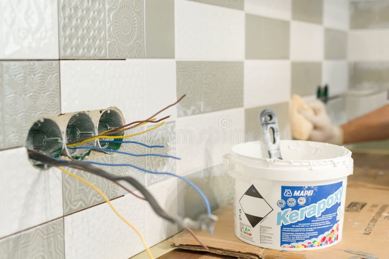 Kyiv, UA, 15-03-2019. Bucket of mapei kerapoxy two-component, decorative, acid resistant epoxy grout for tile joints. Installing and grouting decorative finishes in environments with an high aesthetic value. Acid aesthetic stock images, royalty-free photos and pictures