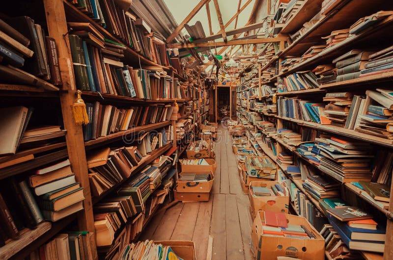 Abandoned bookshelves in old market with antique magazines and books