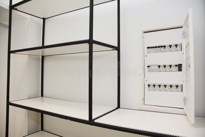 Hidden in White Closet. Opened Safety Electrical Switch Box Installed into the Wall Stock Image