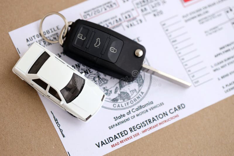 KYIV, UKRAINE - OCTOBER 1, 2025 Validated registration card with remote control car keys stock photo