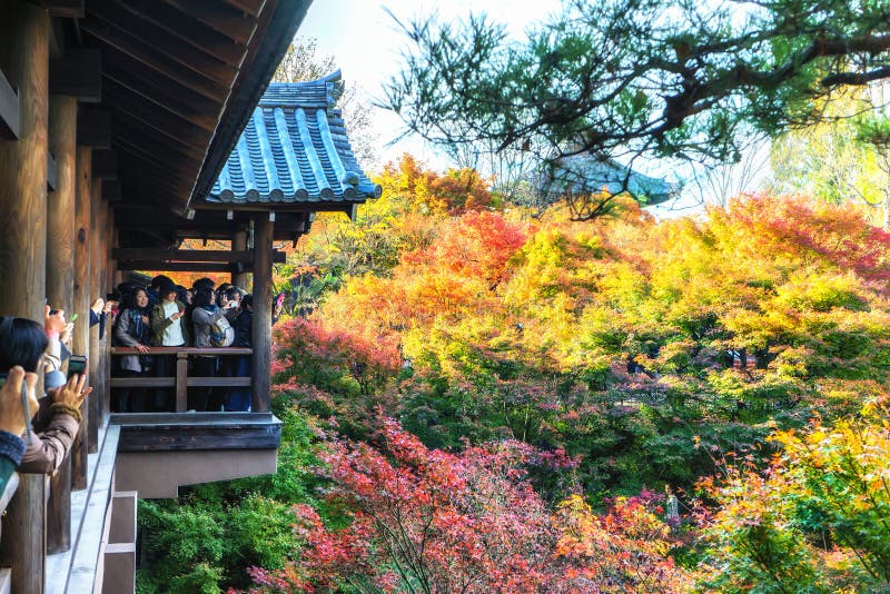 KYOTO - 28 Nov 2015: Tourists crowd to take pictures on a wooden stock image KYOTO - 28 Nov 2015: Tourists crowd to take pictures on a wooden stock image