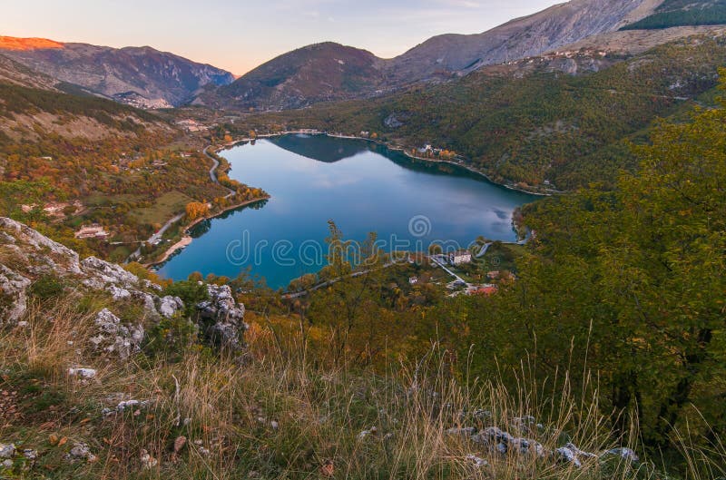 The heart lake in Scanno Abruzzo, Italy - Mountain lake shaped like a heart in autumn season at sunrise, Italy. The heart lake in Scanno Abruzzo, Italy - Mountain lake shaped like a heart in autumn season at sunrise, Italy