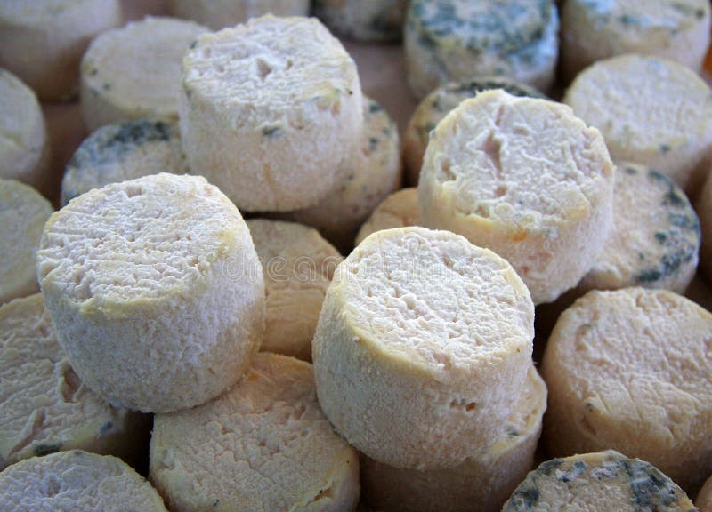 Fresh cheeses for sale at a French market. Fresh cheeses for sale at a French market