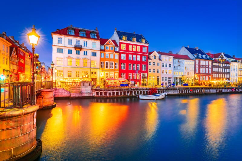 Charm of Copenhagen, Denmark at Nyhavn. Iconic canal, colorful night image and breathtaking water reflections. Charm of Copenhagen, Denmark at Nyhavn. Iconic canal, colorful night image and breathtaking water reflections