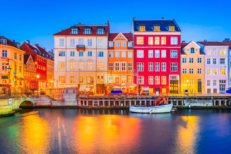 Charm of Copenhagen, Denmark at Nyhavn. Iconic canal, colorful night image and breathtaking water reflections. Charm of Copenhagen, Denmark at Nyhavn. Iconic canal, colorful night image and breathtaking water reflections