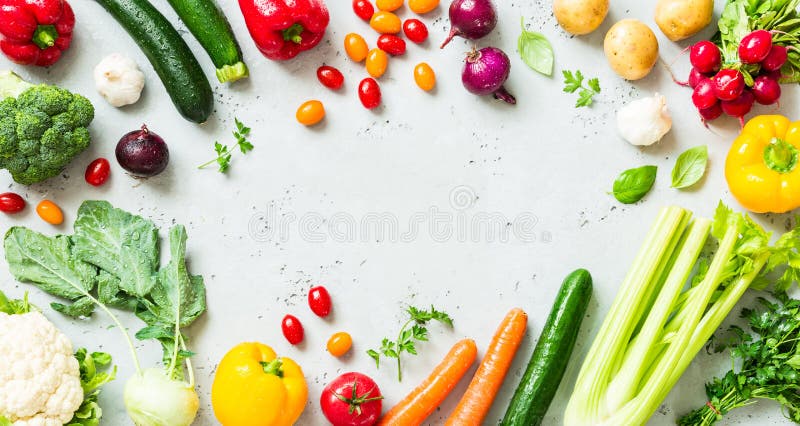 Kitchen - fresh colorful organic vegetables captured from above top view, flat lay. Grey stone worktop as background. Layout with free text copy space. Kitchen - fresh colorful organic vegetables captured from above top view, flat lay. Grey stone worktop as background. Layout with free text copy space.