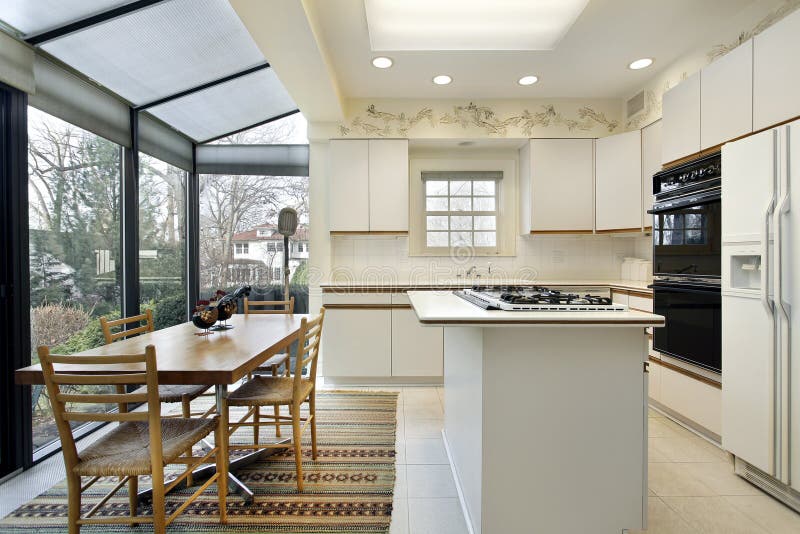 Kitchen with island and sliding doors to patio. Kitchen with island and sliding doors to patio