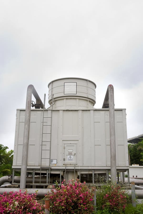 A large cooling tower in city. A large cooling tower in city