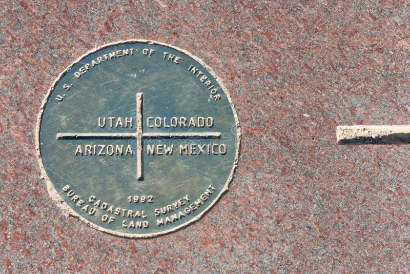 Metal plaque at the Four Corners monument where Utah, Arizona, New Mexico and Colorado meet. Metal plaque at the Four Corners monument where Utah, Arizona, New Mexico and Colorado meet.