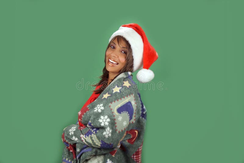 A lovely mature black woman wearing a Santa's helper hat and wrapped in a cozy holiday / winter themed blanket, is obviously excited about your product or service. There's plenty of blank space for inserting text, logos, graphics, etc. A lovely mature black woman wearing a Santa's helper hat and wrapped in a cozy holiday / winter themed blanket, is obviously excited about your product or service. There's plenty of blank space for inserting text, logos, graphics, etc.