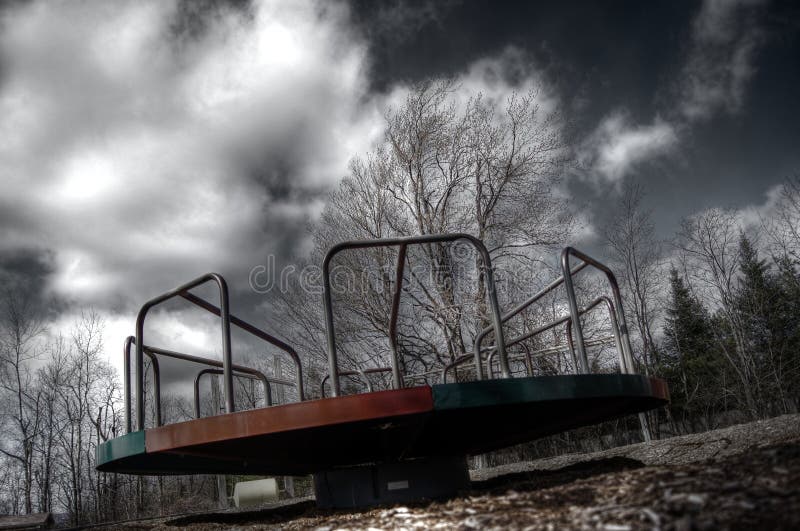 A low, eerie view of a vintage merry go round. A low, eerie view of a vintage merry go round.