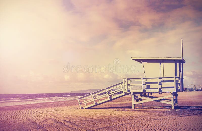 Vintage filtered picture of wooden lifeguard tower at sunset, beach in California, USA. Vintage filtered picture of wooden lifeguard tower at sunset, beach in California, USA.