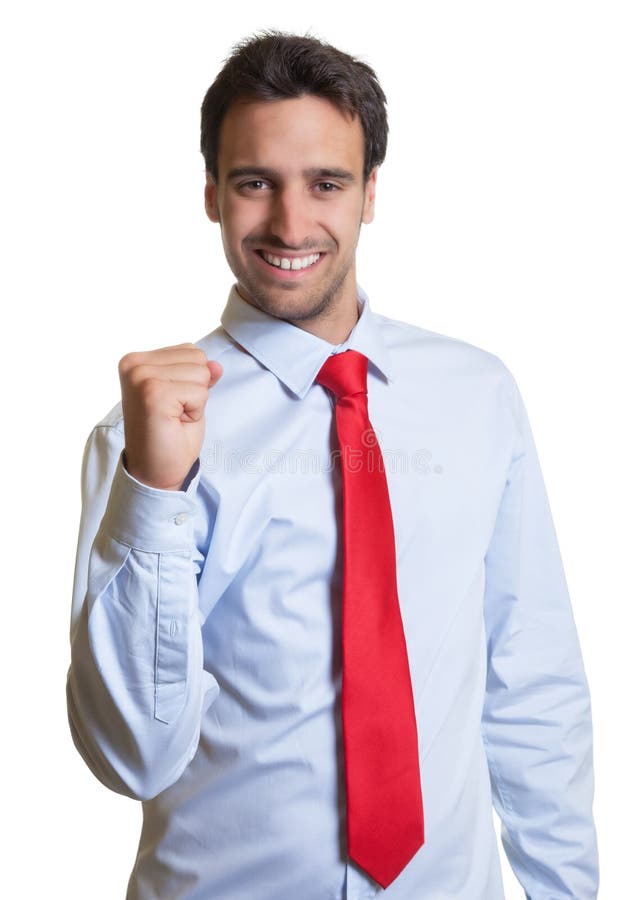 L'homme d'affaires latin avec le lien rouge est heureux images stock L'homme d'affaires latin avec le lien rouge est heureux images stock