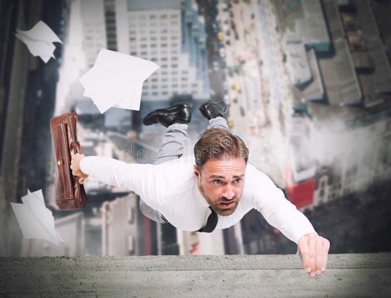 Businessman is going to fall from a skyscraper. Businessman is going to fall from a skyscraper