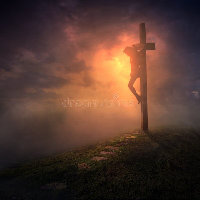 Jesus hanging on the cross with the skies getting dark. Jesus hanging on the cross with the skies getting dark