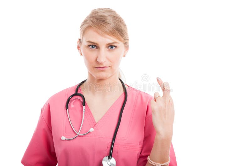 L'infermiere femminile medico attraente che fa le dita ha attraversato il gesto fotografia stock L'infermiere femminile medico attraente che fa le dita ha attraversato il gesto fotografia stock