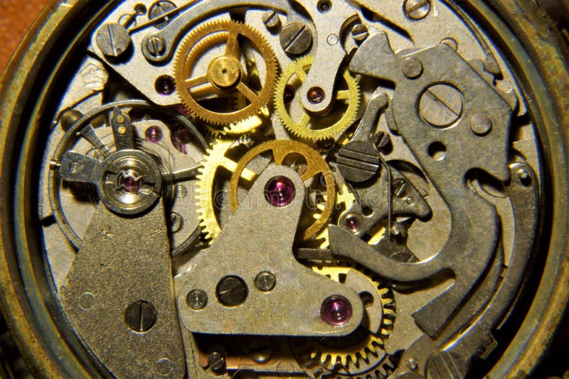 L'orologio mostra il tempo del meccanismo di ingranaggio fotografia stock libera da diritti L'orologio mostra il tempo del meccanismo di ingranaggio fotografia stock libera da diritti